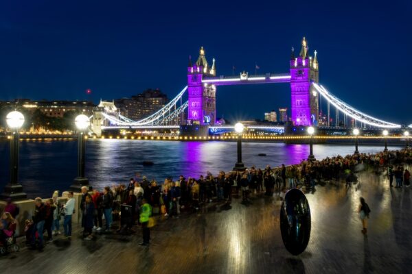 LONDON, UK - SEPTEMBER 17: The Queue to see Queen Elizabeth II lying-in-state near Tower Bridge at night in London, UK on September 17, 2022