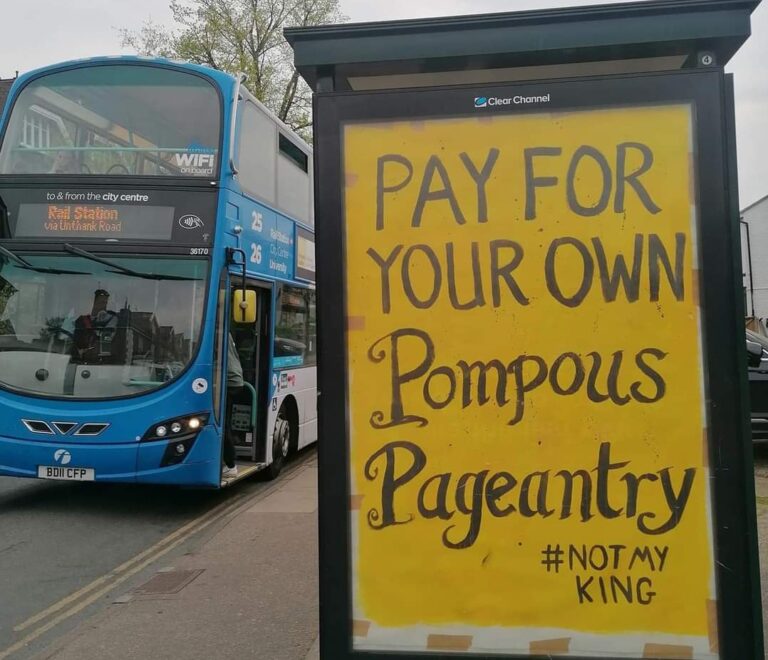 Unauthorized anti-Coronation poster in a bus stop ad space in Norwich by Specialpatrols