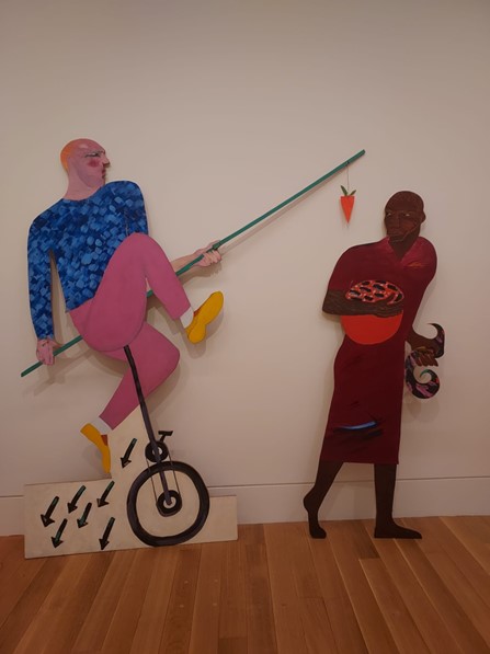 The Carrot Piece shows a white man failing to tempt a black woman with a carrot. Her arms are already full with everything she needs. Himid says that when the work was made, cultural institutions ‘needed to be seen’ to be integrating black people into their programmes and ‘we as black women understood how we were being patronised ... to be cajoled and distracted by silly games and pointless offers. We understood, but we knew what sustained us… and what we really needed to make a positive cultural contribution: self-belief, inherited wisdom, education and love.’