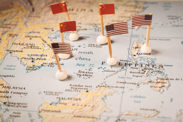 flags of china and the united states on a map of the south china sea. Concept of the south china sea diplomatic conflict