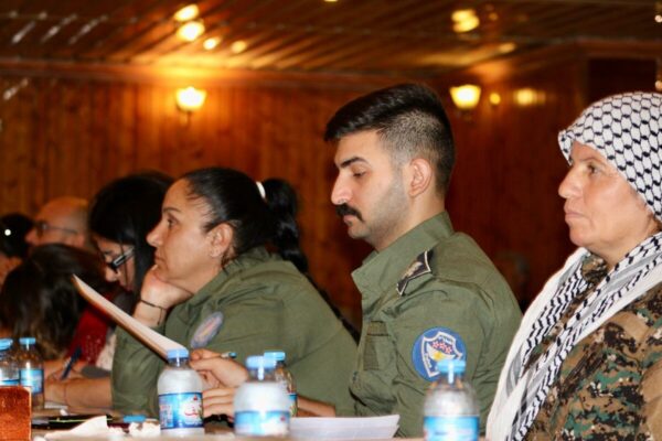 Photo 4: Members of a Syriac self-defense force attending a conference titled Syriacs and the Lausanne Treaty, organized by the Syriac Union Party that is part of the Autonomous Administration. Photo by Anna Rebrii