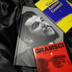 Rome, Italy - November, 24 2019, book on the biography of Ernesto Guevara, known as el Che, an Argentine revolutionary, with books on the life of Antonio Gramsci Italian philosopher and politician.