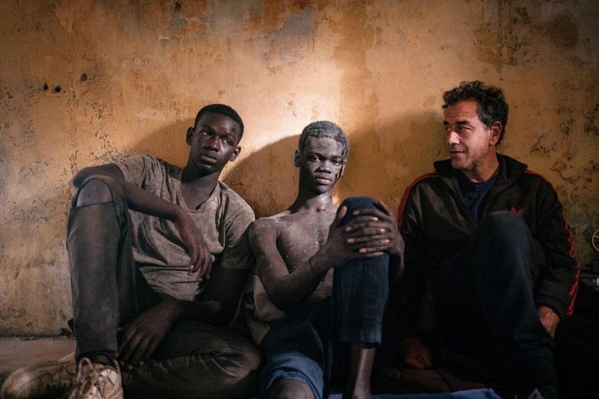 Seydou Sarr as Seydou, Moustapha Fall as Moussa and the film's director Matteo Garrone.