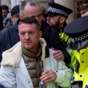 London UK. 26 November 2023. Police arrest far right agitator Tommy Robinson at the March Against Antisemitism outside the Royal Courts of Justice, Strand, London.