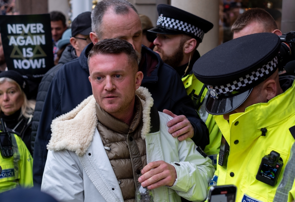 London UK. 26 November 2023. Police arrest far right agitator Tommy Robinson at the March Against Antisemitism outside the Royal Courts of Justice, Strand, London.