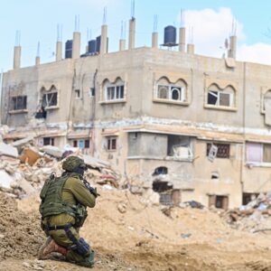 Han Yunis - Feb 7th 2024, Gaza stip. An IDF infantry commando soldier is covering towards ruin building.