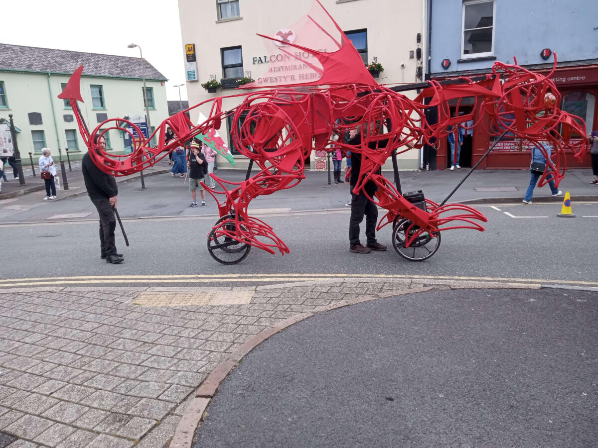A red dragon model on the the YesCymru march in Caerfyrddin/Carmarthen