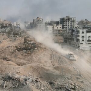 Tank driving with dust in al-shati refugee camp, Gaza, aerial Drone view over North Gaza in the war with Israel. Gaza-March,20,2024