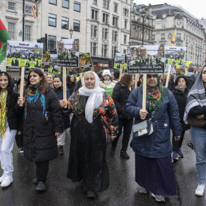 4 women with placards leading a demonstration in the rain in central London on 1 December 2024