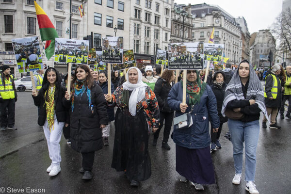 4 women with placards leading a demonstration in the rain in central London on 1 December 2024