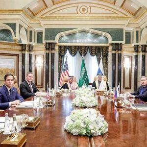 Representatives of US and Russia sit round a large table with people from Saudi Arabia at its head