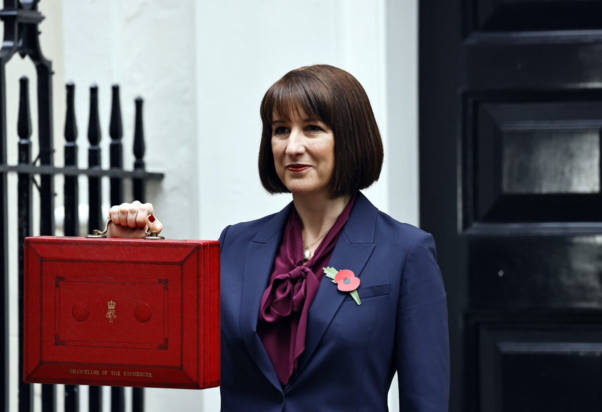 Rachel Reeves outside 11 Downing Street with red briefcase held at chest height