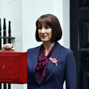 Rachel Reeves outside 11 Downing Street with red briefcase held at chest height