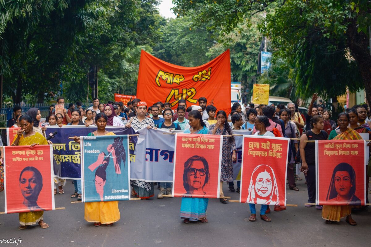 Women carried pictures of women revolutionaries, reminding people of the legacy of female resistance as they marched against violence against women