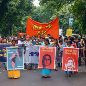 Women carried pictures of women revolutionaries, reminding people of the legacy of female resistance as they marched against violence against women