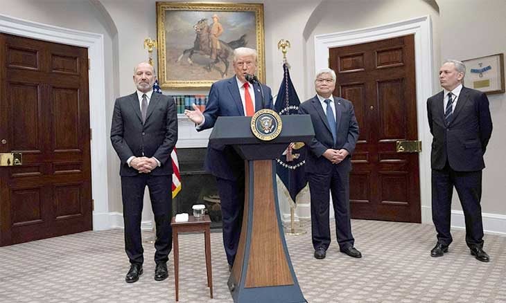 Trump at podium as if about to speak flanked by henchman