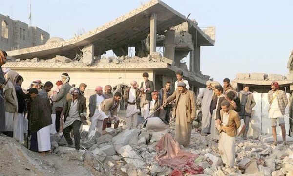 Group of people around collapsing buildings