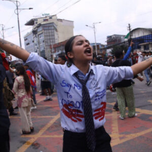 Female protestor in Nepal supporting the downfall of the Prime Minister