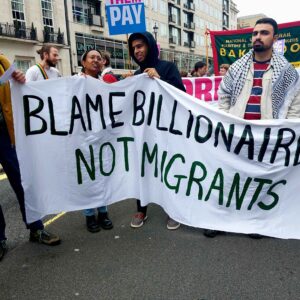 Hanf made banner Blame billionaires not migrants