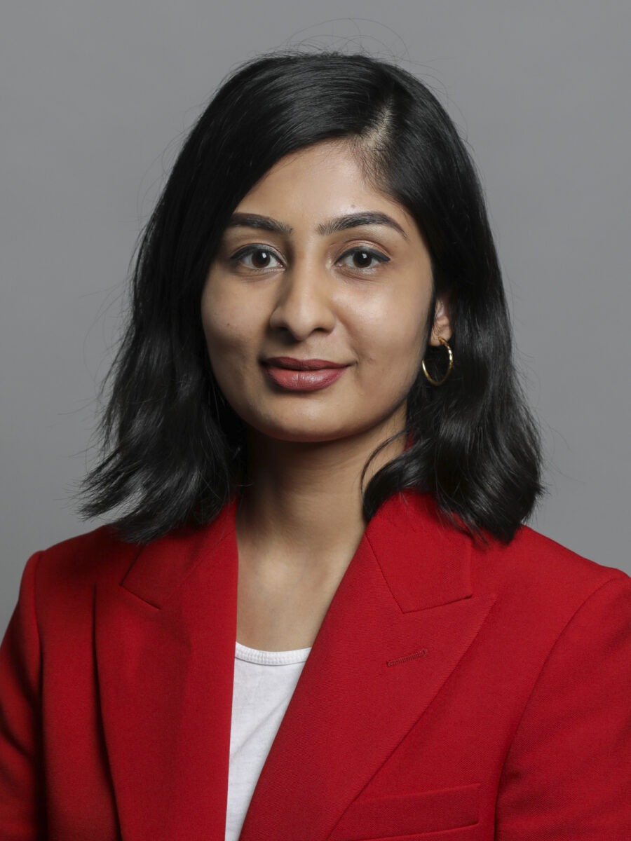 Potrait on Zara Sultana in read suit