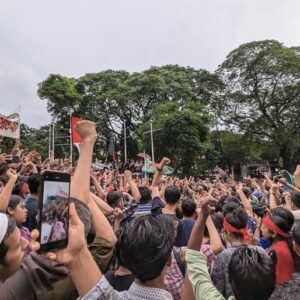 Protestors in Bangladesh with their fists in the air