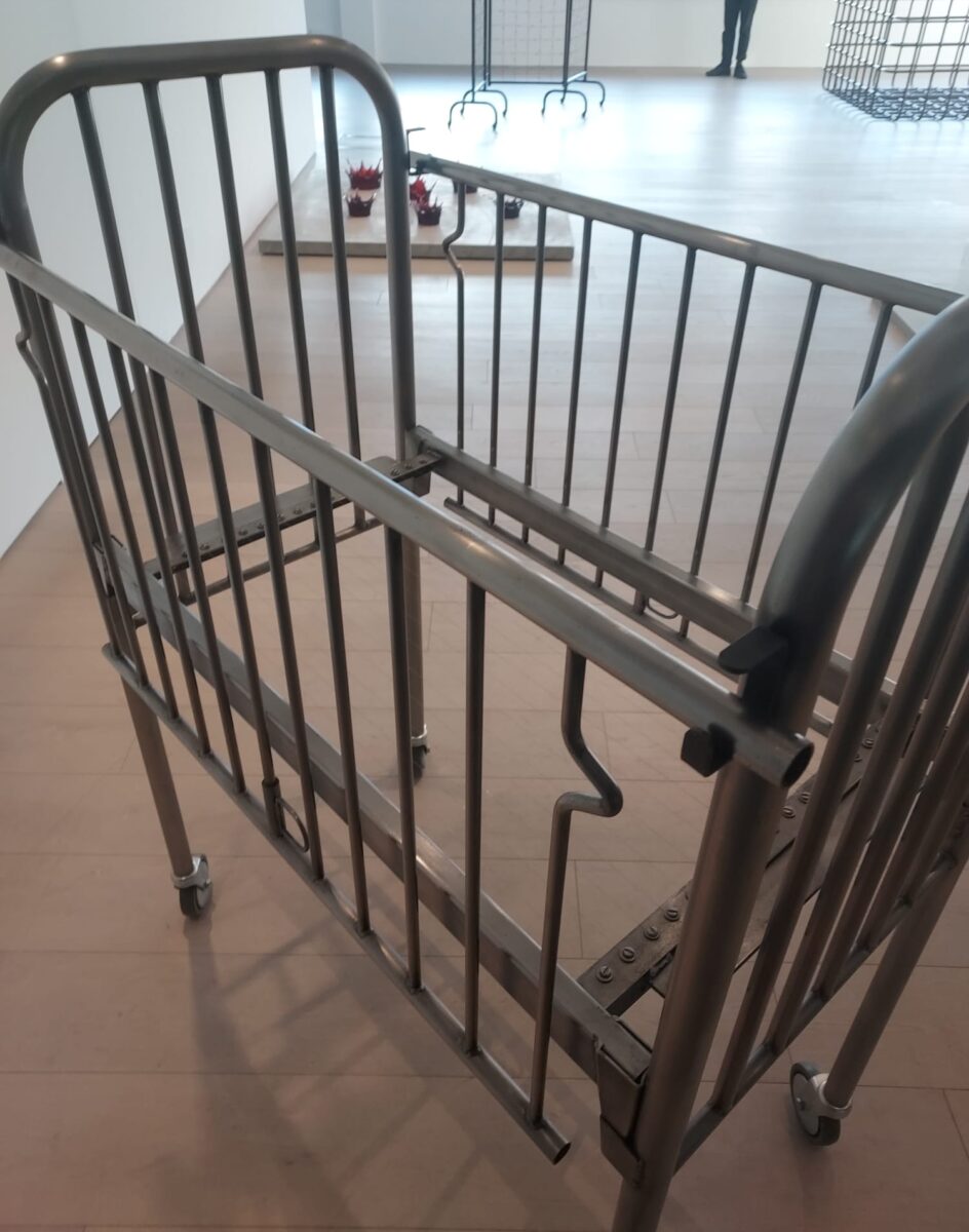 Sculpture by Hatouim of a child's cut without mattress but with the base made of cheesewire