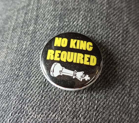 a badge saying No King Required
