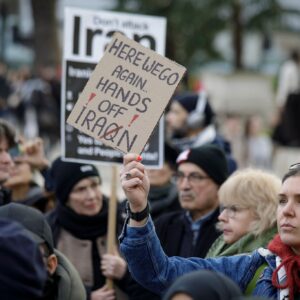 London demo 28 2 2026 Young woman holding hand made sign saying: Here we go again - Dont attach Iraq with q deleted and replaced by n. Photo: Steve Eason