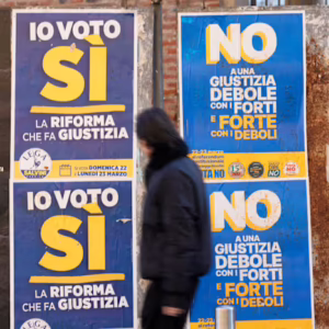 Yes and no posters on wall for Italian referendum on justice reforms