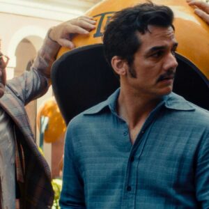 still from film Secret Agent, lead character surrounded by local corrupt police