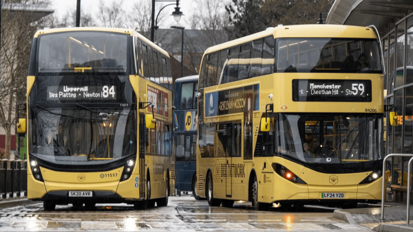 Two yellow buses from Greater Manchesters Bee network