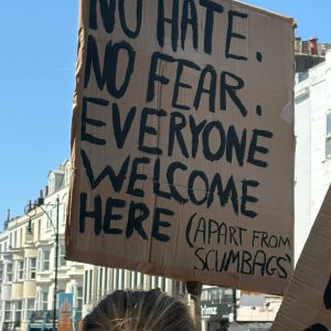 No hate, no fear, everyone welcome here - except scumbags on cardboard placard. Brighton Carnival against Fascism. Photo: Andy Richards