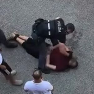 Fakir morocc an migrant held down by Italian police