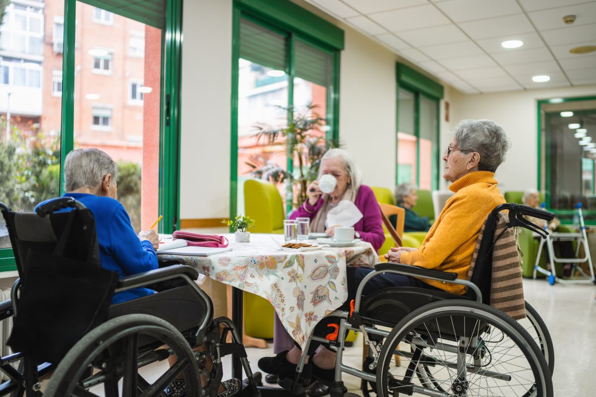 shutterstock phone of 3 women in a care home