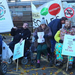 Disabled people protesting. https://commons.wikimedia.org/wiki/File:Disabled_people_protesting_outside_Norfolk_County_Hall_against_Norfolk_County_Council_cuts_to_services_(October_2015).jpg Source: https://www.flickr.com/photos/rogerblackwell/22390785430/. Author: Roger Blackwel, licensed under the Creative Commons Attribution 2.0 Generic license.