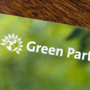 Green Party logo and words on green booklet Photo: Shutterstock