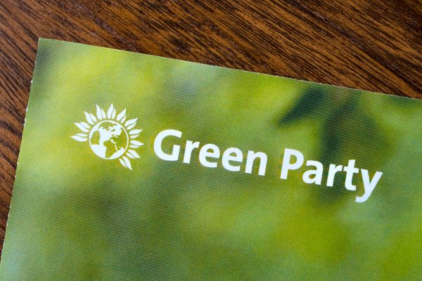 Green Party logo and words on green booklet Photo: Shutterstock